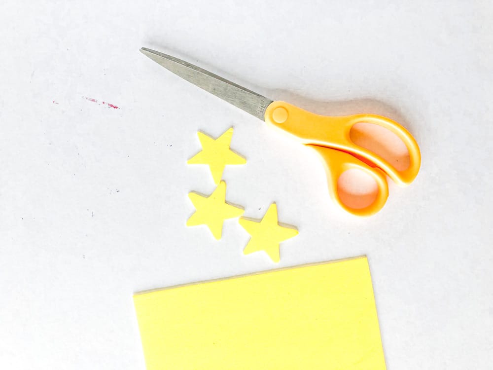 cut yellow stars out of the yellow form