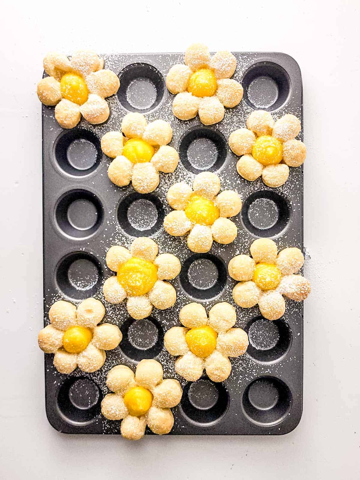 dust with powdered sugar on lemon curd flower cookies