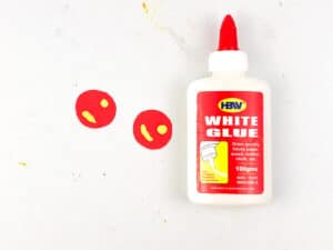 glue small yellow pieces to red circles